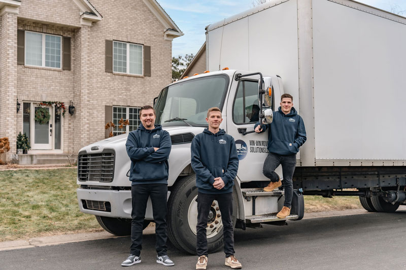 Win Win Moving Solutions team in front of the truck