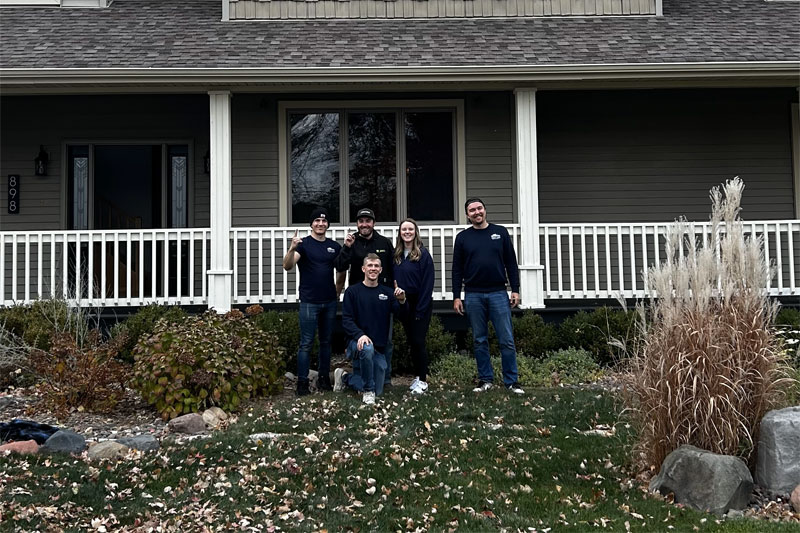 Win Win Moving Solutions team with satisfied client after the successful move